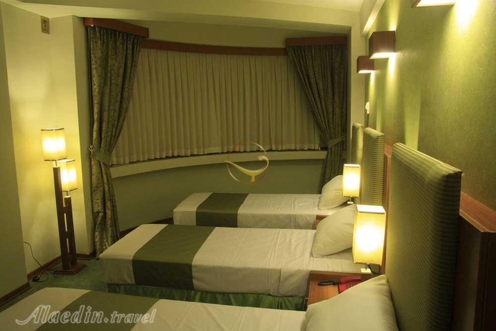 Triple room of three star Atlas Hotel in Mashhad| Alaedin Travel